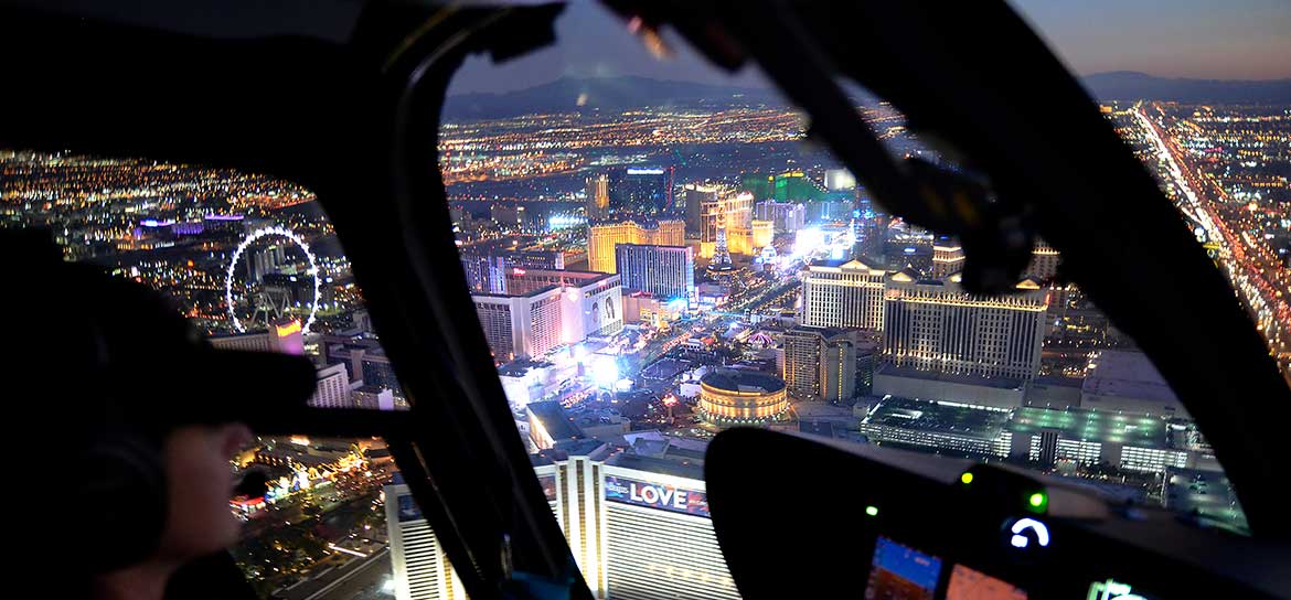 An aerial view of the Las Vegas Strip through the window of a helicopter