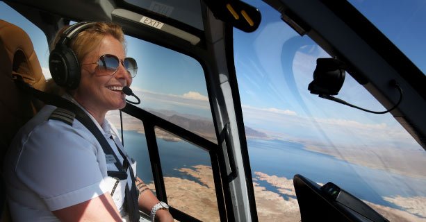 Female helicopter pilot midflight.