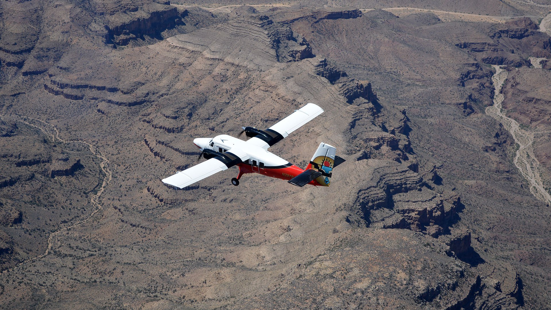 A Grand Canyon airplane tour flies over the desert scenery.