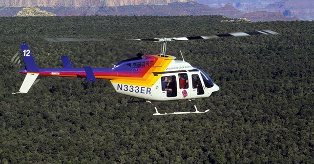 A Grand Canyon helicopter tour flies over the Kaibab National Forest.