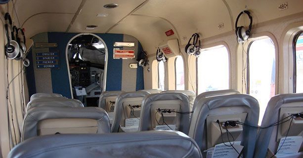 The interior cabin of a Twin Otter aircraft.