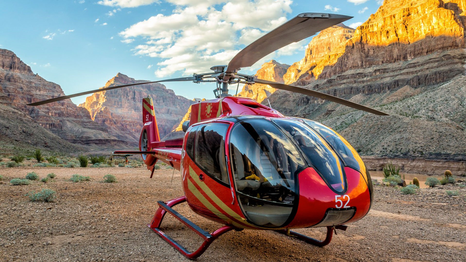 Red EC-130 helicopter landed at the bottom of Grand Canyon West Rim