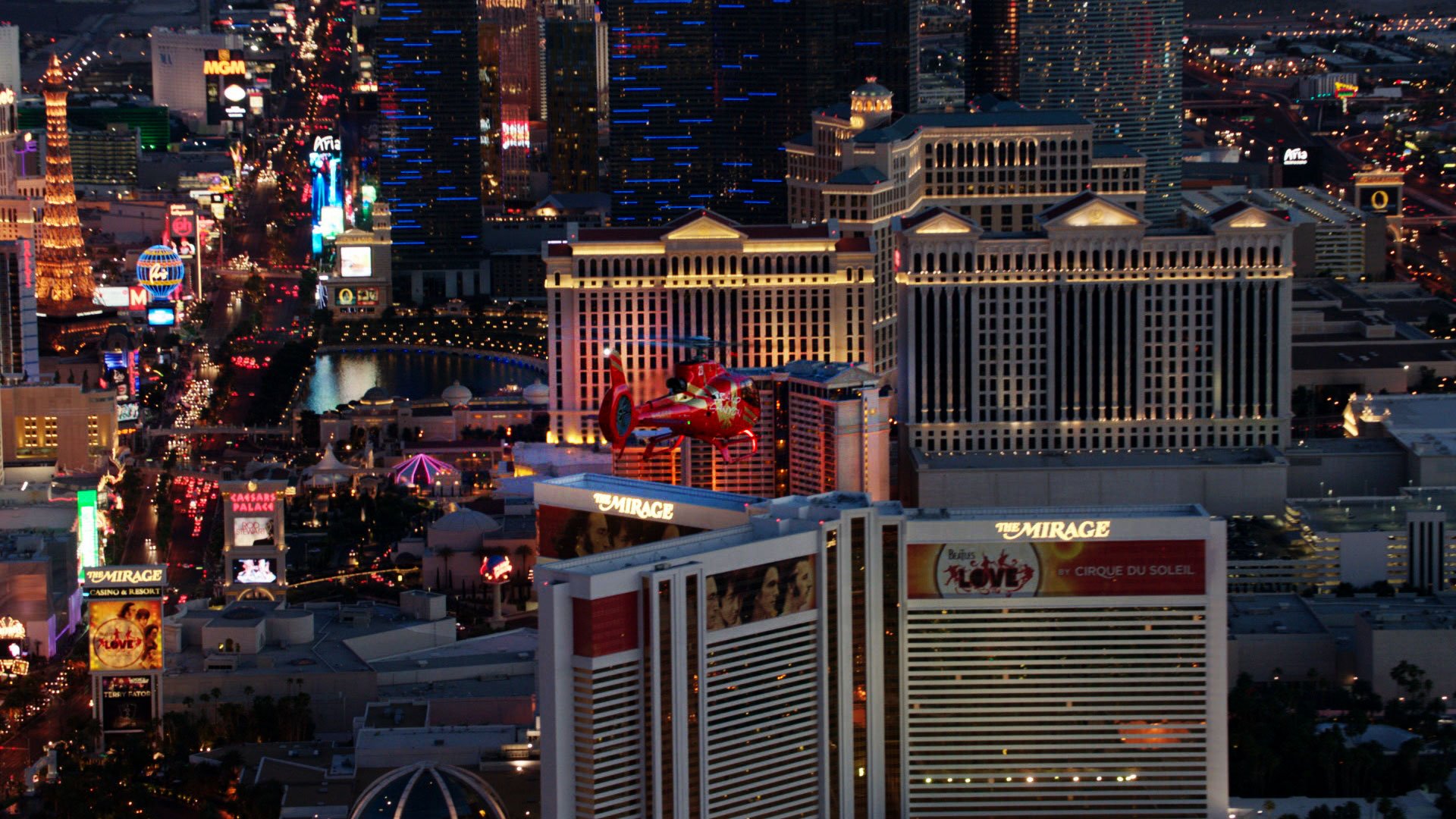 A helicopter tour over the Las Vegas Strip at nighttime.