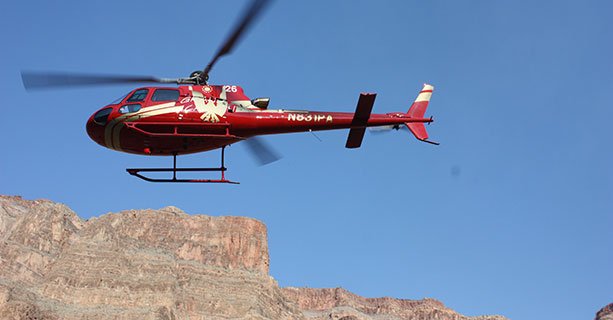 A helicopter takes to the sky at the Grand Canyon.