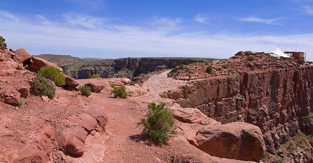 A unique canyon lookout point with a white picnic tent in the background.