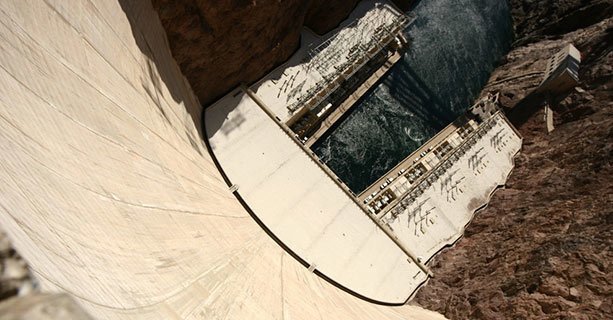 The bottom of Hoover Dam and the Colorado River seen from above.