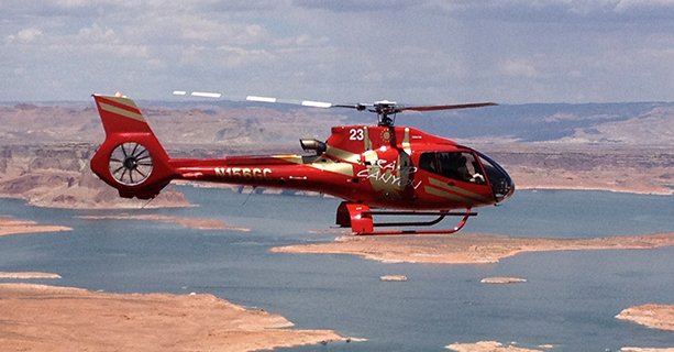 A helicopter soars above Lake Powell.