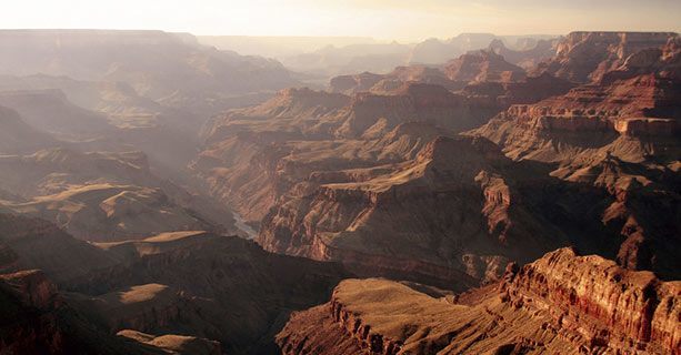 A view of the misty expanse of the Grand Canyon.