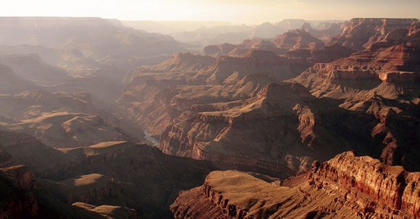 Sunbeams radiating onto the walls of the Grand Canyon.