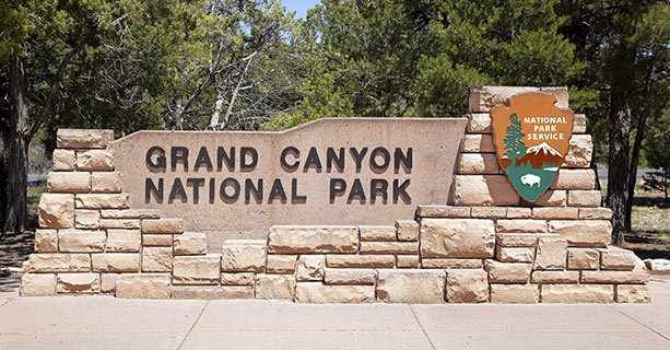 Stone sign that reads Grand Canyon National Park.