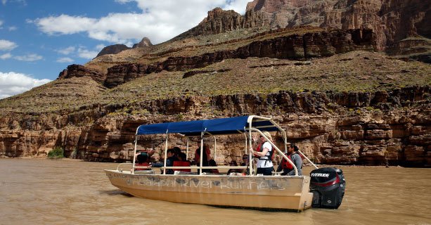 Passengers aboard a pontoon boat on the Colorado River.