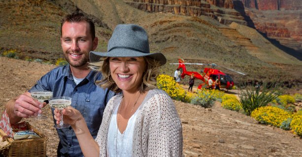 Helicopter passengers enjoy a champagne toast and picnic on the Grand Canyon floor.