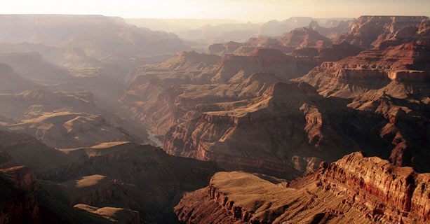 An image of the sun radiating on the the walls of the Grand Canyon.