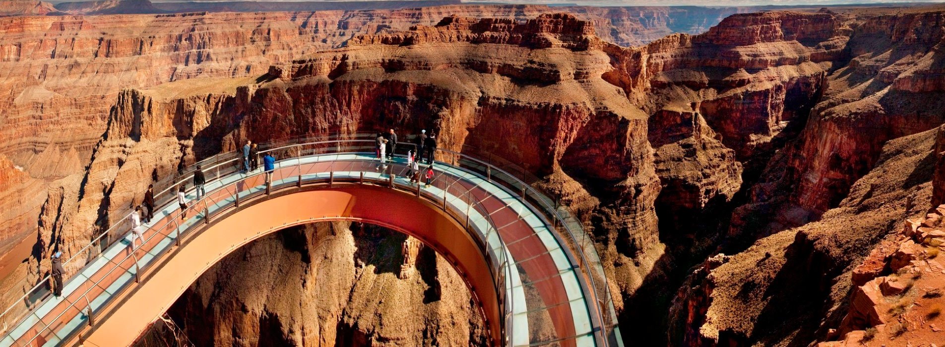 Guests standing on the Skywalk Bridge at the Grand Canyon West Rim.