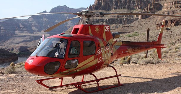 A helicopter landed on the Grand Canyon floor.