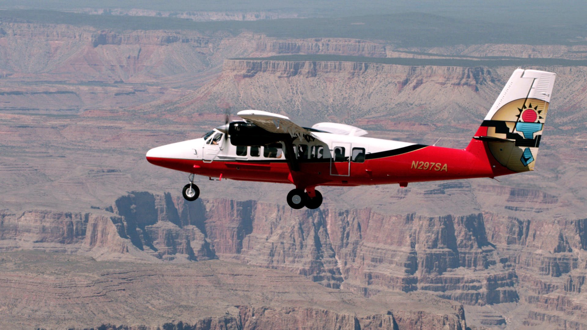 Twin Otter plane flying over the Grand Canyon on a South Rim airplane tour.