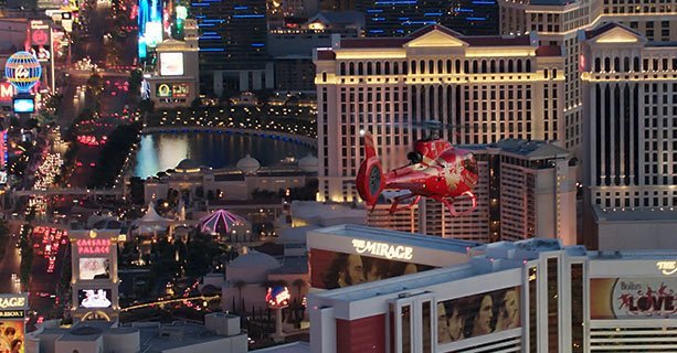 EC-130 red helicopter flying over the Las Vegas Strip