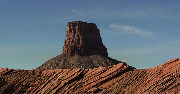 A champagne picnic set atop Tower Butte with Lake Powell in the background.