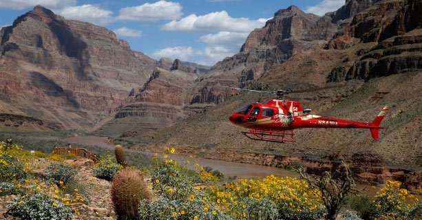 A helicopter descends to the floor of the Grand Canyon.